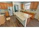 Spacious kitchen features wood cabinets, stainless steel appliances, and a large granite island at 3938 E Chaffe Ave, Pahrump, NV 89061