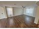 Cozy living room with hardwood floors and bright, natural light from large windows at 3938 E Chaffe Ave, Pahrump, NV 89061