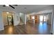 Spacious living area with hardwood floors and an open floor plan to the kitchen at 3938 E Chaffe Ave, Pahrump, NV 89061