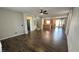 Bright living room with hardwood floors flowing into an open kitchen area at 3938 E Chaffe Ave, Pahrump, NV 89061