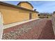 Side yard view with gravel and low water landscaping at 3938 E Chaffe Ave, Pahrump, NV 89061