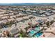 Overhead view of homes, some featuring private pools, solar panels, and desert landscaping at 3961 Equinox Ct, Las Vegas, NV 89147