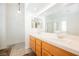 Bathroom area with dual sinks, large mirror, and separate bath shower at 3961 Equinox Ct, Las Vegas, NV 89147