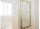 Bathroom with glass shower enclosure, tiled walls, and soaking tub at 3961 Equinox Ct, Las Vegas, NV 89147