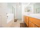Bright bathroom with double sinks, and tiled bath/shower combo at 3961 Equinox Ct, Las Vegas, NV 89147
