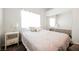 Bedroom featuring neutral carpet, a bright window, and a mirrored closet at 3961 Equinox Ct, Las Vegas, NV 89147