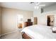 Bedroom featuring carpeted floors, ceiling fan, and ensuite bathroom at 3961 Equinox Ct, Las Vegas, NV 89147