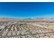 Distant shot of desert homes, capturing the essence of neighborhood living with mountains in background at 3961 Equinox Ct, Las Vegas, NV 89147