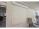 Exterior view showcasing the home's security window shutters and outdoor seating area at 3961 Equinox Ct, Las Vegas, NV 89147