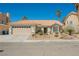Charming single-story home with a well-manicured xeriscaped front yard and tile roof at 3961 Equinox Ct, Las Vegas, NV 89147