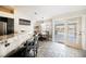 Bright kitchen and breakfast nook with granite countertops, stainless steel appliances, and access to the backyard pool at 3961 Equinox Ct, Las Vegas, NV 89147