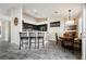 Stylish kitchen with granite countertops, a breakfast bar, and modern appliances, adjacent to the dining area at 3961 Equinox Ct, Las Vegas, NV 89147