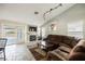 Inviting living room features a fireplace, tile floors, and comfortable seating with outdoor views at 3961 Equinox Ct, Las Vegas, NV 89147