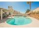 Backyard pool with a waterfall feature surrounded by the patio and seating areas at 3961 Equinox Ct, Las Vegas, NV 89147