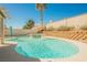 Sparkling pool featuring a tanning deck, palm tree, and surrounding patio space at 3961 Equinox Ct, Las Vegas, NV 89147