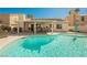 Refreshing pool with a covered patio and outdoor seating, perfect for entertaining and relaxation at 3961 Equinox Ct, Las Vegas, NV 89147