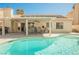 Inviting backyard pool and covered patio with dining set, ideal for outdoor gatherings at 3961 Equinox Ct, Las Vegas, NV 89147