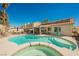 Beautiful backyard featuring a pool, spa, and covered patio, creating a relaxing oasis at 3961 Equinox Ct, Las Vegas, NV 89147
