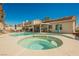 Gorgeous backyard with a sparkling pool and separate spa, surrounded by lush landscaping at 3961 Equinox Ct, Las Vegas, NV 89147