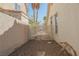 Gated gravel side yard featuring two palm trees at 3961 Equinox Ct, Las Vegas, NV 89147
