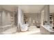 Bright bathroom featuring a modern bathtub, walk-in shower, and vanity at 4 Kaya Canyon Way # 15, Henderson, NV 89012