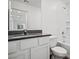 Bright bathroom features a shower over tub and sleek vanity with countertop at 4216 Golden Sol St, North Las Vegas, NV 89032