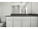 Bathroom featuring a gray countertop, white vanity, and glass-enclosed shower at 4216 Golden Sol St, North Las Vegas, NV 89032