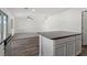 Modern kitchen with stainless appliances, gray counters, and a breakfast bar at 4216 Golden Sol St, North Las Vegas, NV 89032