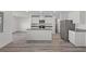 Modern kitchen featuring white cabinets, stainless steel appliances, and a center island at 4253 Gold Desert St, North Las Vegas, NV 89032