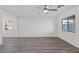 Spacious living area with light hardwood floors, neutral paint, and lots of natural light at 4253 Gold Desert St, North Las Vegas, NV 89032