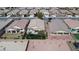 Overhead shot of homes with landscaped yards, desert landscaping, and paved driveways in suburban community at 4429 S Glory Vine Ln, Pahrump, NV 89061