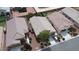 An aerial view of several single-Gathering homes in a suburban neighborhood, featuring desert landscaping at 4429 S Glory Vine Ln, Pahrump, NV 89061