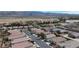 Aerial view of a residential neighborhood with mountain views in the distance and well maintained landscaping at 4429 S Glory Vine Ln, Pahrump, NV 89061