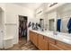 Spacious bathroom features double sinks and a walk-in closet for optimal storage at 4429 S Glory Vine Ln, Pahrump, NV 89061