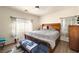 Cozy bedroom featuring neutral tones, soft lighting, and comfortable furnishings at 4429 S Glory Vine Ln, Pahrump, NV 89061