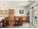 Cozy dining area adjacent to kitchen features a round table, natural light, and stylish accents at 4429 S Glory Vine Ln, Pahrump, NV 89061