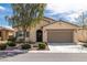 Charming single-story home featuring desert landscaping, a two-car garage and a welcoming front entrance at 4429 S Glory Vine Ln, Pahrump, NV 89061