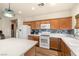 Bright kitchen featuring central island, stainless steel appliances and breakfast bar seating at 4429 S Glory Vine Ln, Pahrump, NV 89061