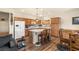 Spacious kitchen featuring stainless steel appliances, central island, and breakfast bar seating at 4429 S Glory Vine Ln, Pahrump, NV 89061