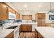 Modern kitchen features stainless steel appliances, tile backsplash, and efficient layout at 4429 S Glory Vine Ln, Pahrump, NV 89061
