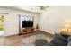 Bright living room with hardwood floors, large window, and a neutral color palette at 4429 S Glory Vine Ln, Pahrump, NV 89061