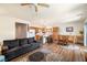 Open-concept living room with a dining area, connected to a kitchen with stainless steel appliances at 4429 S Glory Vine Ln, Pahrump, NV 89061