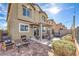 Charming backyard featuring a brick patio, pergola, and cozy seating perfect for outdoor entertaining at 4442 Solitude Falls Ave, North Las Vegas, NV 89084