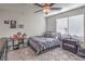 Bright bedroom features carpet, a ceiling fan, and natural light at 4442 Solitude Falls Ave, North Las Vegas, NV 89084