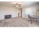 Bedroom with carpet, a ceiling fan, a desk, and a view to a closet at 4442 Solitude Falls Ave, North Las Vegas, NV 89084