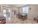 Dining room with lots of natural light from a nearby window and convenient access to the kitchen at 4442 Solitude Falls Ave, North Las Vegas, NV 89084