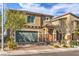 Charming two-story home with a two-car garage, landscaped front yard, and inviting curb appeal at 4442 Solitude Falls Ave, North Las Vegas, NV 89084