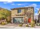 Attractive two-story house with a two-car garage, desert landscaping, and a welcoming front entrance at 4442 Solitude Falls Ave, North Las Vegas, NV 89084