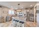Bright kitchen featuring stainless steel appliances, granite countertops, and a central island with pendant lighting at 4442 Solitude Falls Ave, North Las Vegas, NV 89084