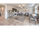Comfortable living room featuring tile flooring, ample seating, and a decorative fireplace at 4442 Solitude Falls Ave, North Las Vegas, NV 89084